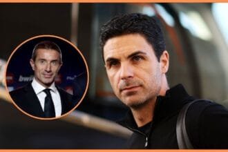 Mikel Arteta walks toward bus next to picture of