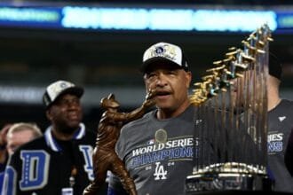Dave Roberts urges Dodgers fans not to think about the World Series yet as the season begins