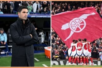 Mikel Arteta and an Arsenal flag at the Emirates Stadium