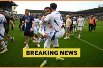 Ethan Ampadu celebrates Leeds winning the Championship