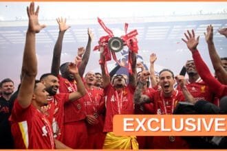 Luis Diaz celebrates with his Liverpool teammates as they lift the Premier League trophy