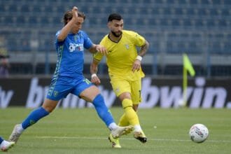Valentin Castellanos of SS Lazio compete for the ball with Jacopo Fazzini
