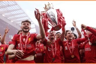 Federico Chiesa and his Liverpool teammates celebrate with the Premier League trophy