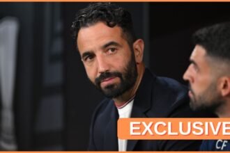 Ruben Amorim looks concerned whilst sitting on the bench.