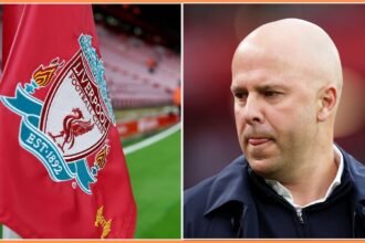 Liverpool FC logo on flag and manager Arne Slot