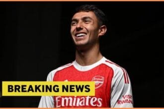Martin Zubimendi poses in his Arsenal kit, plus breaking news banner