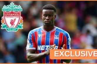 Marc Guehi of Crystal Palace and the Liverpool FC logo