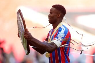Marc Guehi lifts the Community Shield trophy