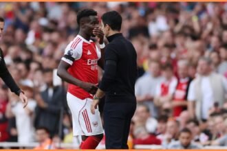 Bukayo Saka and Mikel Arteta