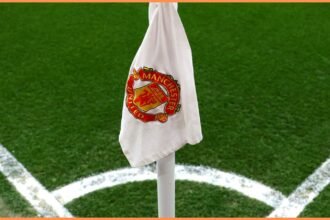 Close-up of Manchester United logo on corner flag