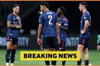 William Saliba and his Arsenal teammates plus yellow breaking news banner