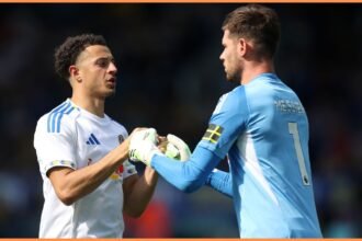 Ethan Ampadu interacts with teammate Illan Meslier during the pre-season friendly between Leeds and Villarreal