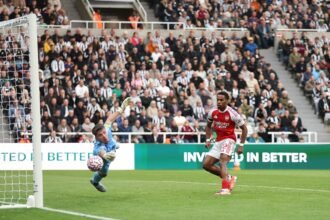 Arsenal's Julientimber has a shot saved by Nick Pope