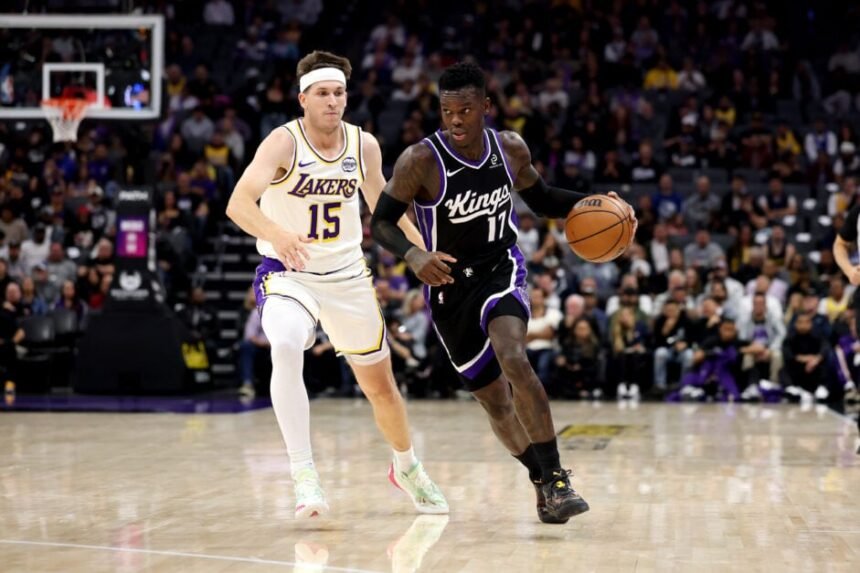 No. 17 Dennis Schroder of the Sacramento Kings is guarded by No. 15 Austin Reeves of the Los Angeles Lakers during the first quarter at Golden 1 Center on October 26, 2025 in Sacramento, California.