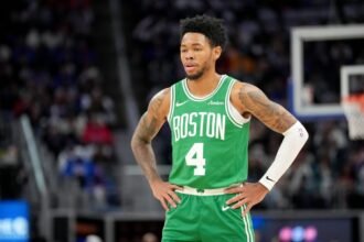 Boston Celtics No. 4 Anfernee Simons watches the first quarter against the Detroit Pistons at Little Caesars Arena.