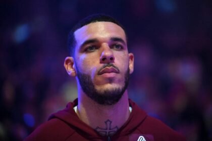 Lonzo Ball #2 of the Cleveland Cavaliers listens to the national anthem before a preseason game against the Detroit Pistons at Rocket Arena.
