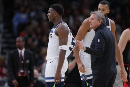 Minnesota Timberwolves head coach Chris Finch and the Minnesota Timberwolves guard Anthony Edwards, 5, during the second half of a game against the Chicago Bulls at United Center on November 7, 2024 in Chicago, Illinois.