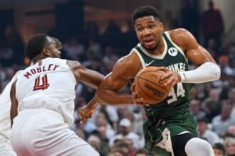 Milwaukee Bucks forward Giannis Antetokounmpo #34 drives to the basket around Cleveland Cavaliers center Evan Mobley #4 during the first quarter at Rocket Arena.
