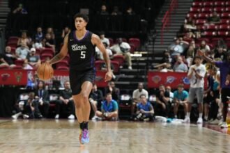 #5 Neek Clifford of the Sacramento Kings dribbles against the Charlotte Hornets during the second half of the 2025 NBA Summer League Championship game at Thomas & Mack Center.