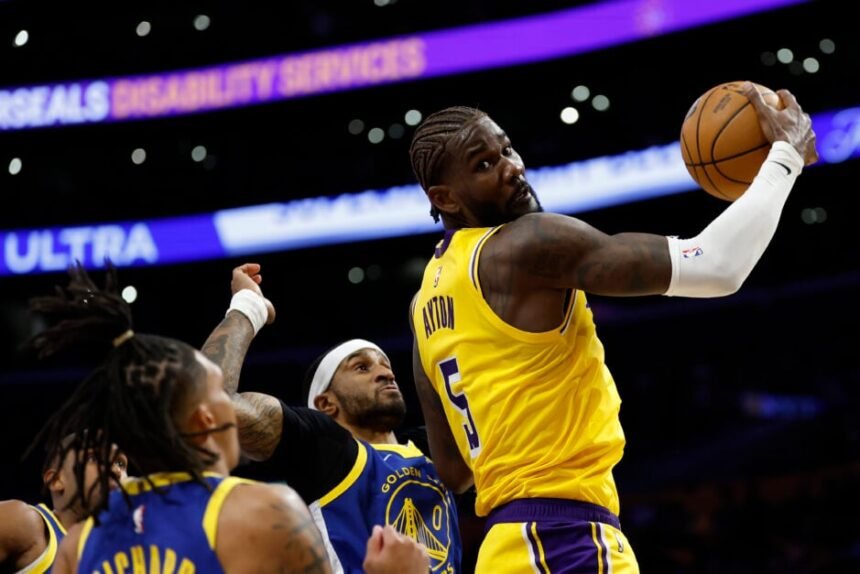 #5 Deandre Ayton of the Los Angeles Lakers spins into the basket against #0 Gary Payton II of the Golden State Warriors during the second quarter of a game at Crypto.com Arena.