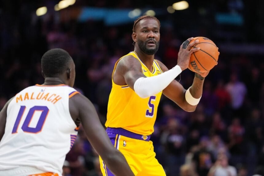 Los Angeles Lakers #5 Deandre Ayton controls the ball during the first half of a preseason NBA game against the Phoenix Suns