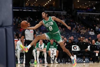 Josh Minott #8 of the Boston Celtics grabs a rebound during the first half of a preseason game against the Memphis Grizzlies at FedExForum on October 8, 2025 in Memphis, Tennessee.