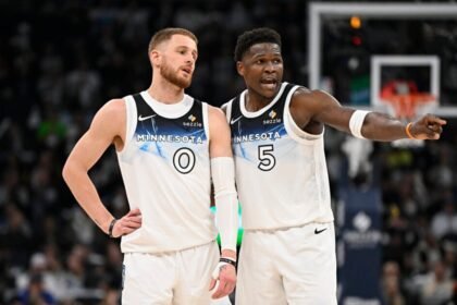 #0 Donte DiVincenzo of the Minnesota Timberwolves speaks with #5 Anthony Edwards during the second quarter of the game against the Brooklyn Nets at Target Center.