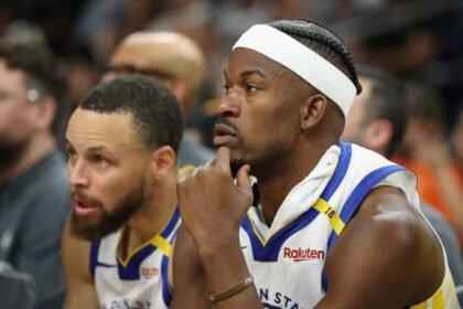 Golden State Warriors stars Jimmy Butler and Stephen Curry are on the bench.