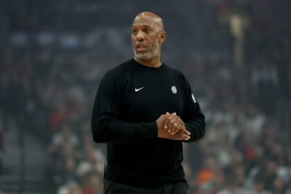 Portland Trail Blazers head coach Chauncey Billips watches a game against the Minnesota Timberwolves at Moda Center.