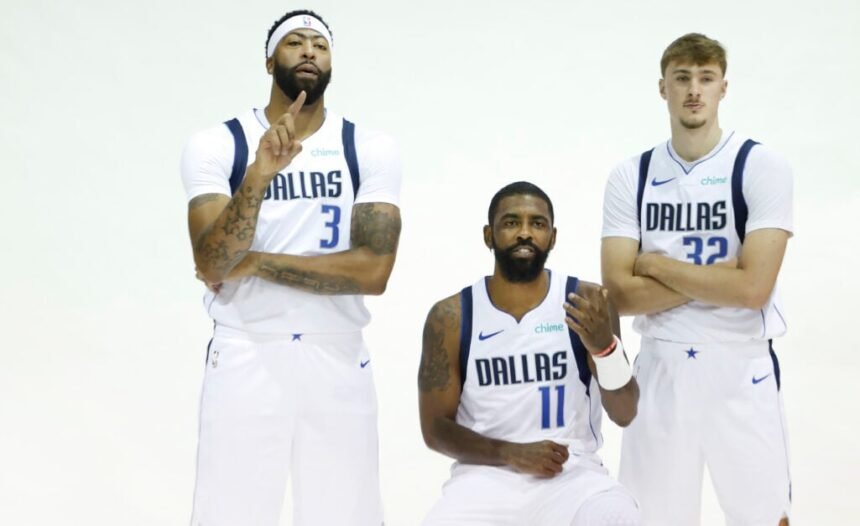 Dallas Mavericks players Anthony Davis #3, Kyrie Irving #11, and Cooper Flagg #32 pose for a photo during Dallas Mavericks Media Day at American Airlines Center.