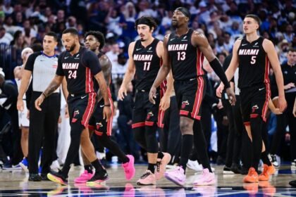 Miami Heat's Norman Powell #24, Davion Mitchell #45, Jaime Jaquez Jr. #11, Bam Adebayo #13 and Nikola Jovic #5 return to the bench during the first half of the game against the Orlando Magic at Kia Center.