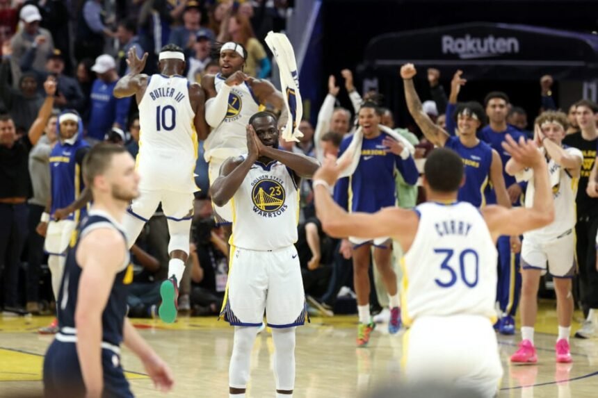 Golden State Warriors forward Draymond Green celebrates signing of teammate Stephen Curry "night night" Celebration.