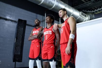 Kevin Durant #7, Alperen Sengan #28, and Armen Thompson #1 of the Houston Rockets pose for a photo during NBA Media Day at Toyota Center.