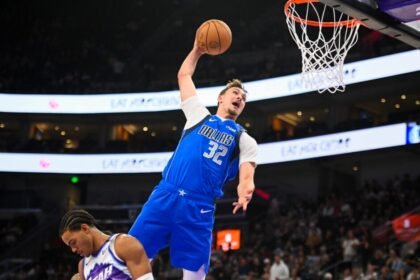 Cooper Flagg #32 of the Dallas Mavericks makes a dunk during the second half of a preseason game against the Dallas Mavericks.