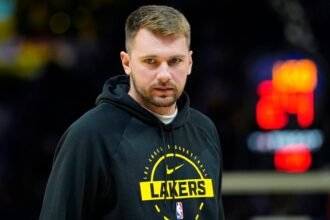 Luka Doncic #77 of the Los Angeles Lakers watches the game against the Golden State Warriors in streetwear