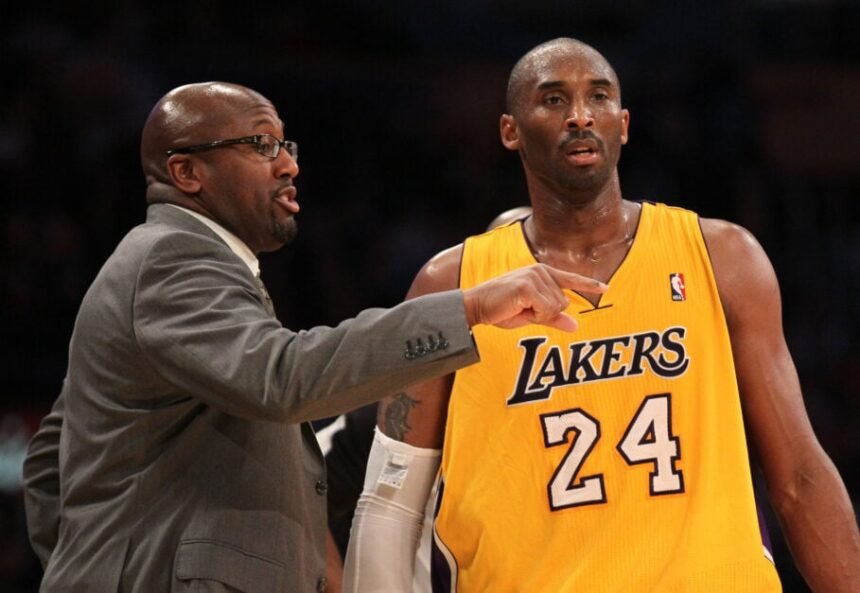 Kobe Bryant #24 of the Los Angeles Lakers speaks with head coach Mike Brown during the game against the Utah Jazz at Staples Center.