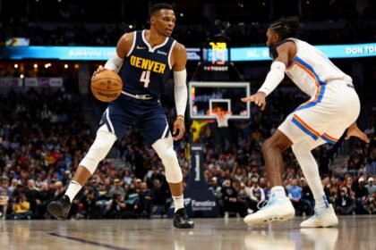 No. 4 Russell Westbrook of the Denver Nuggets handles the ball against Isaiah Joe of the Oklahoma City Thunder.