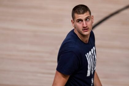 Nikola Jokic (15) of the Denver Nuggets takes the floor against the Los Angeles Lakers before the start of the first quarter at AdventHealth Arena in 2020.