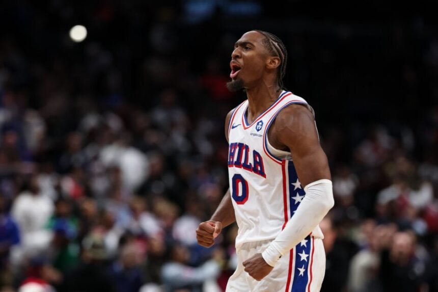 Tyrese Maxey #0 of the Philadelphia 76ers celebrates after playing overtime against the Washington Wizards at Capital One Arena.