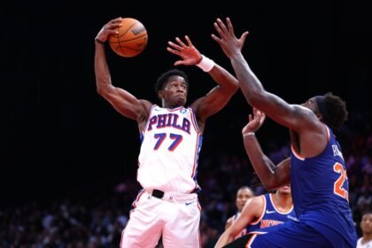VJ Edgecomb, #77 of the Philadelphia 76ers, goes to the basket against Mitchell Robinson #23 of the New York Knicks during the preseason game between the Philadelphia 76ers and the New York Knicks.