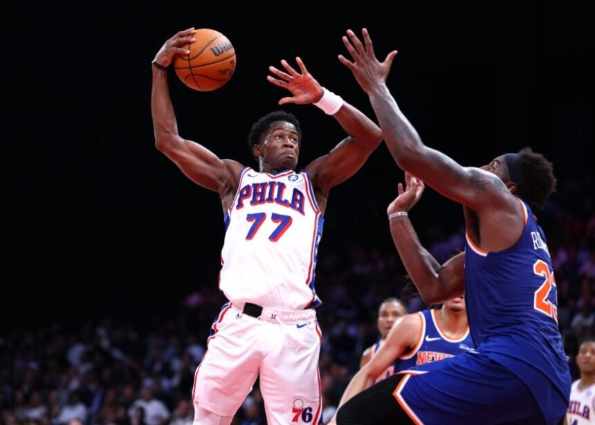 VJ Edgecomb, #77 of the Philadelphia 76ers, goes to the basket against Mitchell Robinson #23 of the New York Knicks during the preseason game between the Philadelphia 76ers and the New York Knicks.