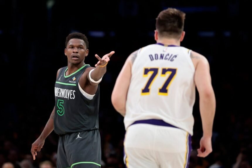 #5 Anthony Edwards of the Minnesota Timberwolves reacts in front of #77 Luka Doncic of the Los Angeles Lakers