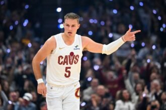 Cleveland Cavaliers guard #5 Sam Merrill celebrates during the first quarter against the Milwaukee Bucks at Rocket Arena.