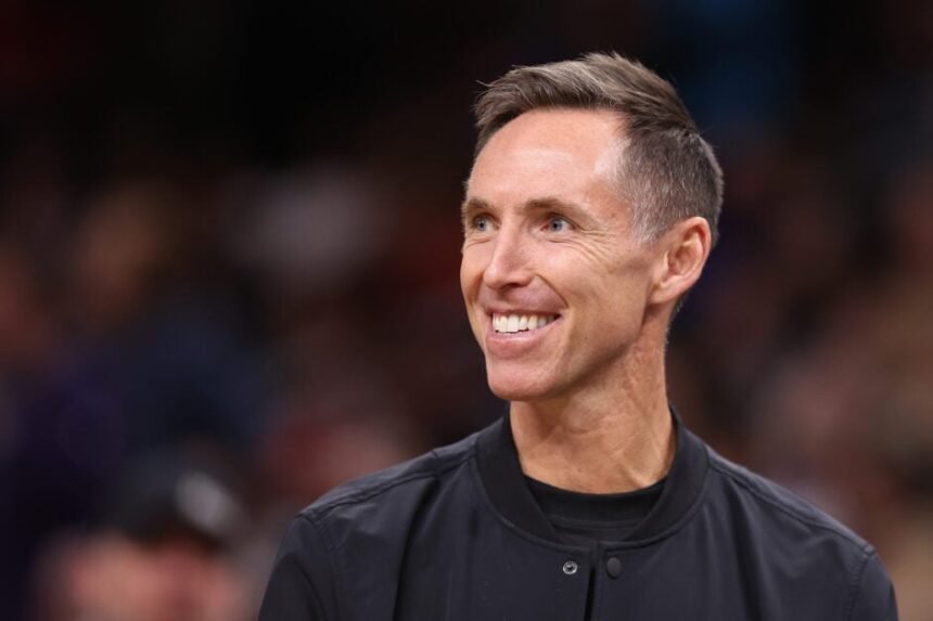 Former Phoenix Suns guard Steve Nash watches the Golden State Warriors vs. Phoenix Suns game at Footprint Center.