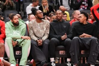 In the first half action, from left to right from the bench, the Toronto Raptors' Brandon Ingram (3), Immanuel Quickley, RJ Barrett, and Scottie Barnes are watching the game.