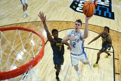 No. 2 Cooper Flagg of the Duke Blue Devils attempts a shot against No. 7 VJ Edgecombe of the Baylor Bears during the second round of the NCAA men's basketball tournament at Lenovo Center on March 23, 2025 in Raleigh, North Carolina.