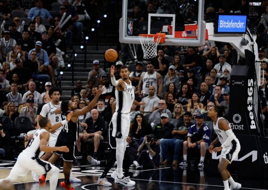 San Antonio Spurs No. 1 Victor Wembaneyama reaches for a loose ball during the second half of a game against the Brooklyn Nets at Frostbank Center in San Antonio, Texas, on October 26, 2025.