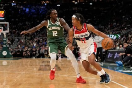 No. 12 Tre Johnson of the Washington Wizards dribbles the ball against No. 12 Taurean Prince of the Milwaukee Bucks during the fourth quarter at Fiserv Forum on Oct. 22, 2025 in Milwaukee, Wisconsin.
