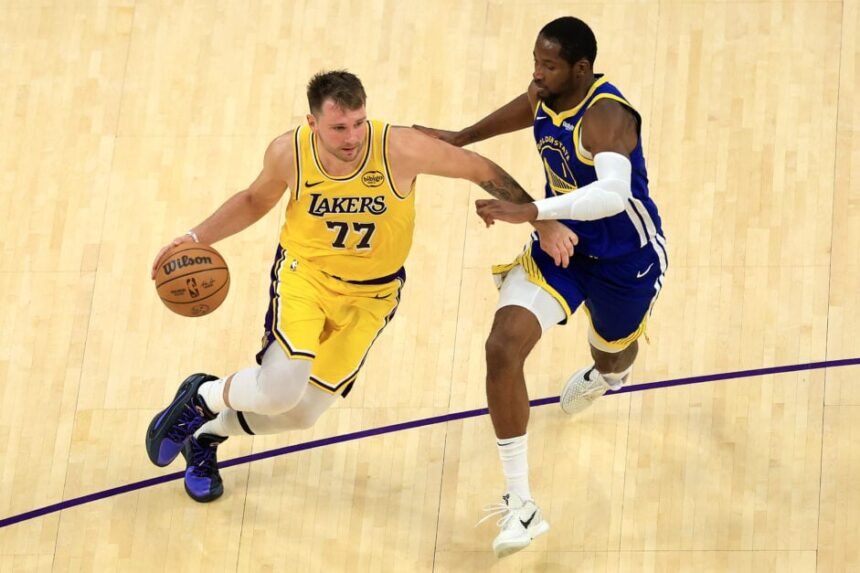 Los Angeles Lakers star Luka Doncic takes on Jonathan Kuminga of the Golden State Warriors.