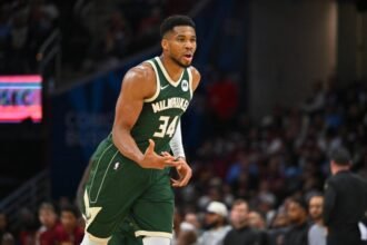 Milwaukee Bucks forward Giannis Antetokounmpo #34 celebrates during the third quarter against the Cleveland Cavaliers at Rocket Arena.